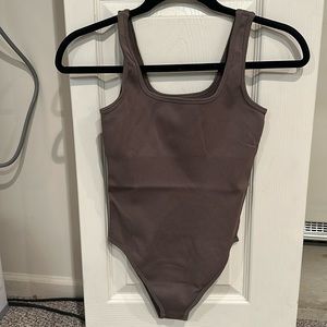 Tummy control brown body suit
